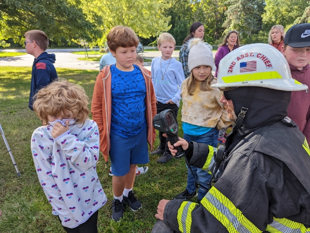 students with fireman 