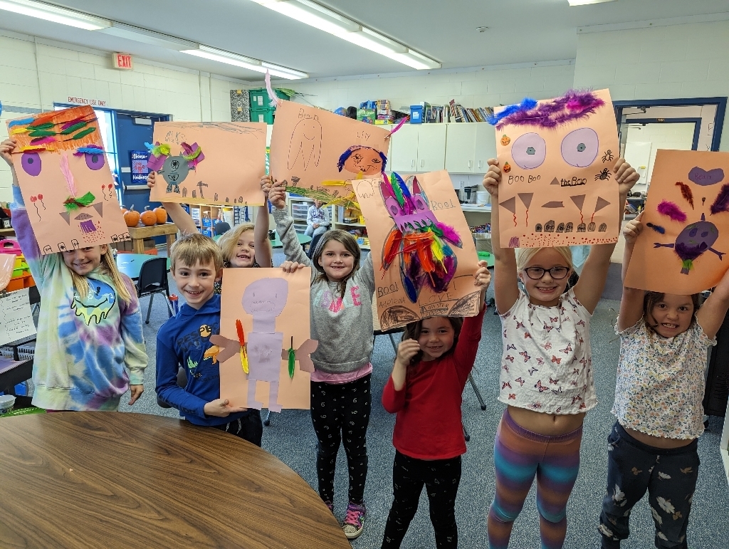 1/2 class holding up their monsters