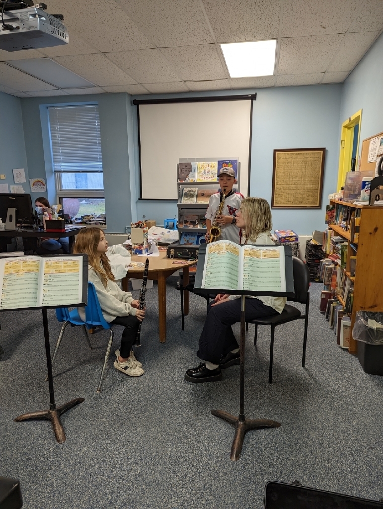 students learning woodwind instruments