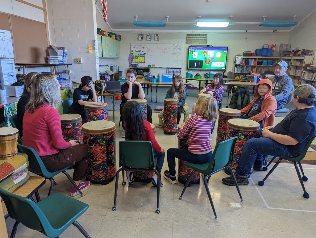 students in drumming circle