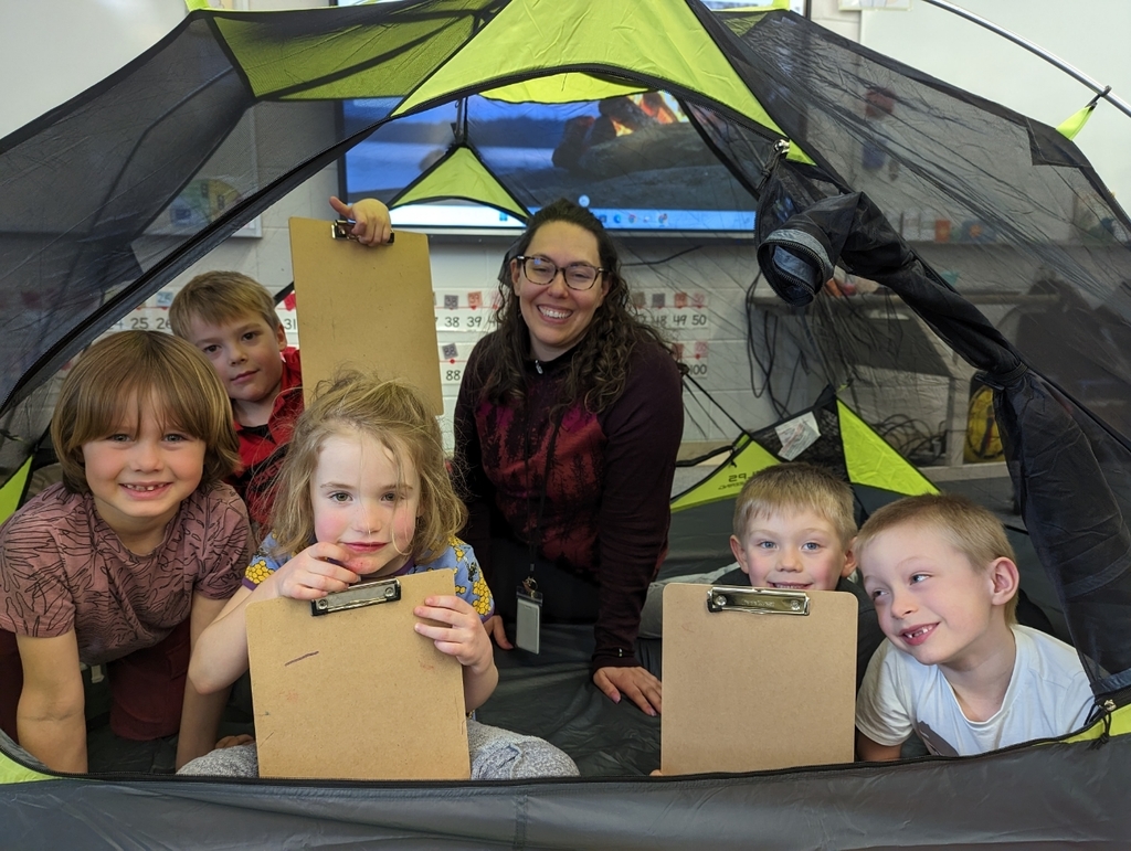 students and Ms Ellison in a tent in the classroom