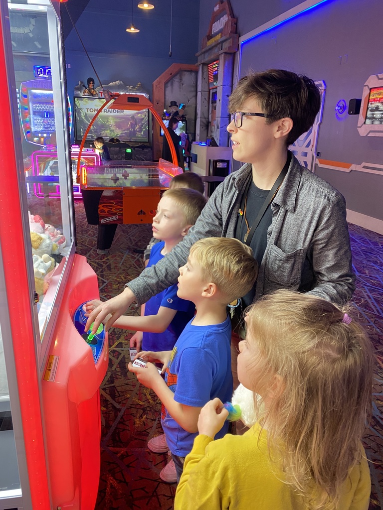 students & teacher in arcade
