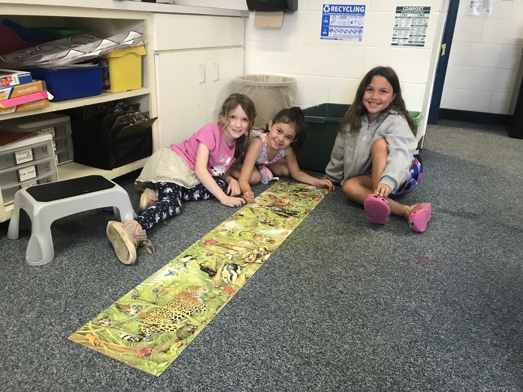 Students building a puzzle